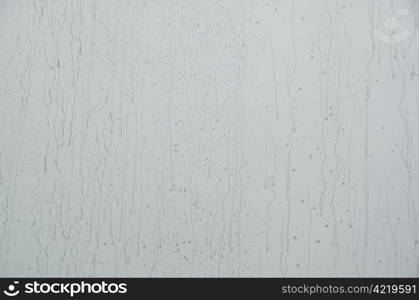 Rain drops on window. Closeup of water drops on a window when it is raining outside