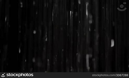 Rain on black. Can be mixed with your footage in screen mode. This is real footage, not cg. Another variants are available.