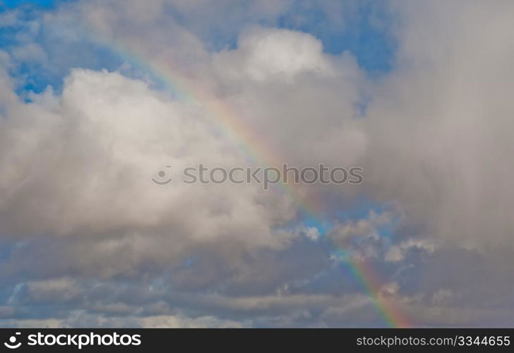 Rainbow and cloudy sky