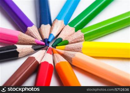 Rainbow color pencils set round isolated on white