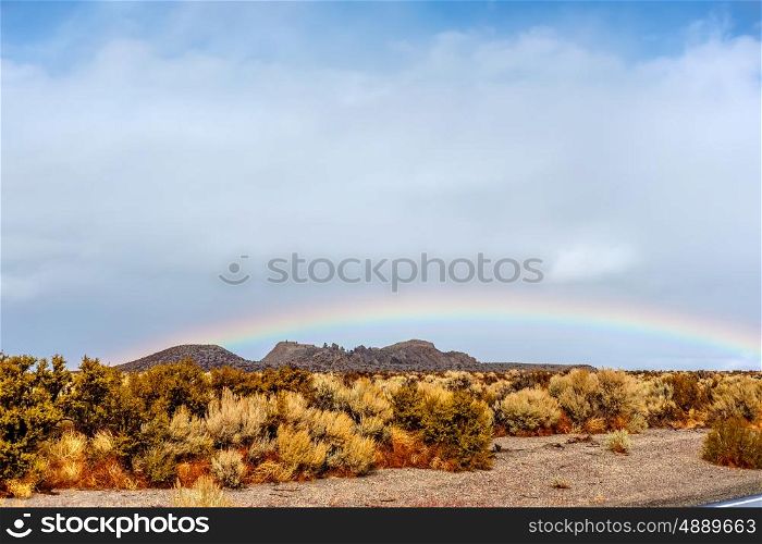 Rainbow in desert, California, USA.