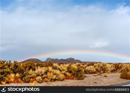 Rainbow in desert, California, USA.