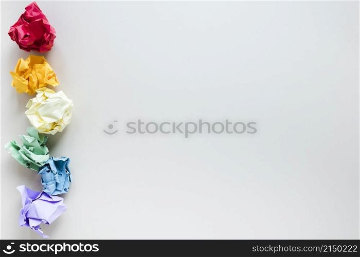 rainbow made six colored crumpled paper balls