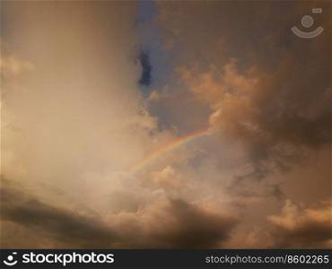 rainbow on sky and cloud with sunlight