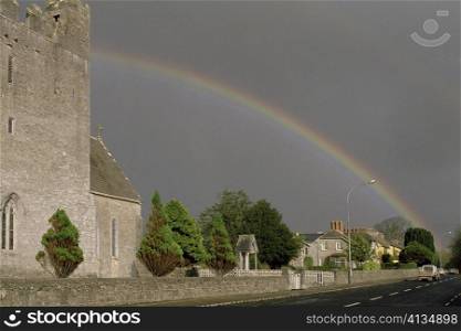 Rainbow over buildings, Adare, Republic of Ireland