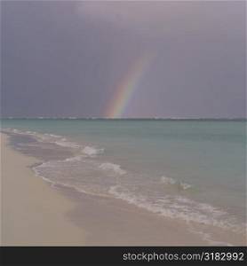 Rainbow over ocean at Parrot Cay