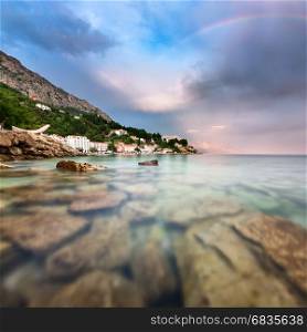 Rainbow over Rocky Beach and Small Village after the Rain, Dalmatia, Croatia