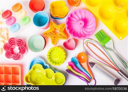 Rainbow silicone confectionery untersils on a white background