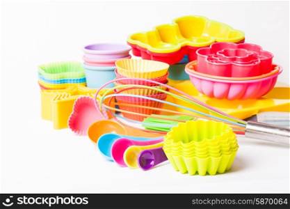 Rainbow silicone confectionery untersils on a white background