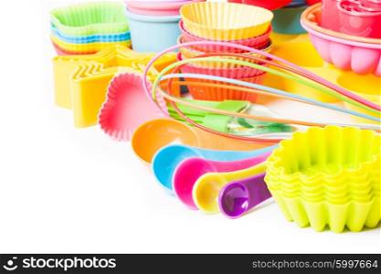 Rainbow silicone confectionery utensils on a white background. Rainbow silicone confectionery utensils