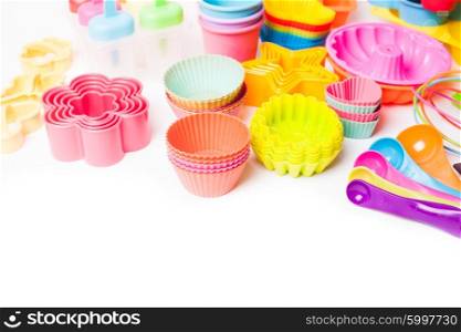 Rainbow silicone confectionery utensils on a white background. Rainbow silicone confectionery utensils