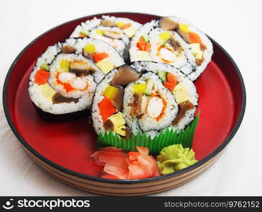 Rainbow Sushi Roll with salmon, eel, tuna, avocado, royal prawn, cream cheese Philadelphia, caviar tobica, chuka. Sushi menu. Japanese food.