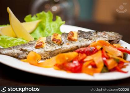 rainbow trout fish. Tasty dish of rainbow trout fish with vegetables