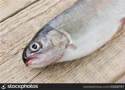 rainbow trout on a wooden board