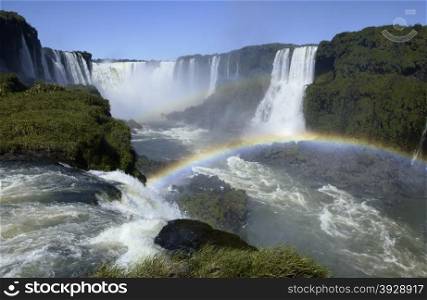 Rainbows in the spray of Iguazu Falls on the border of Brazil and Argentina.