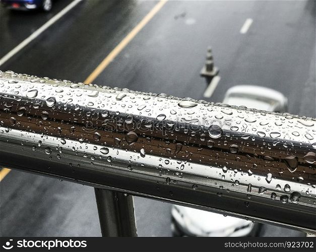 Raindrop on stainless steel in rainy day