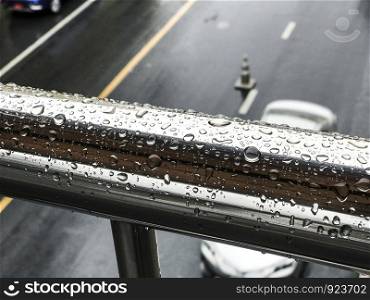Raindrop on stainless steel in rainy day