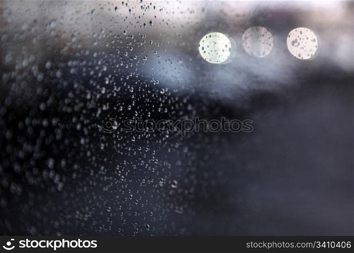 raindrops and light on window