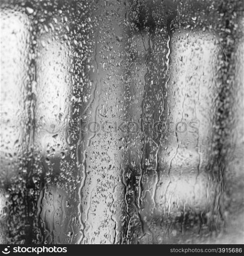 Raindrops on a window pane on the background