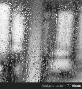 Raindrops on a window pane on the background