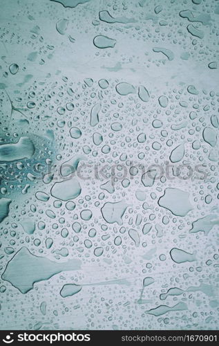 raindrops on the grey metal surface