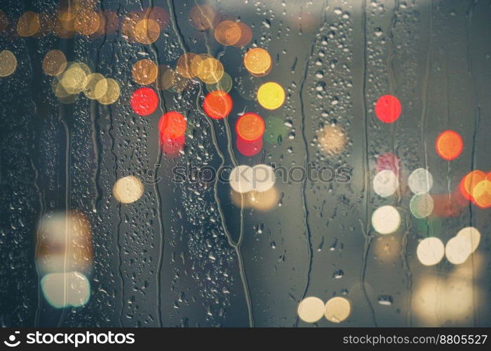                                  raindrops on the window and street lights background at night