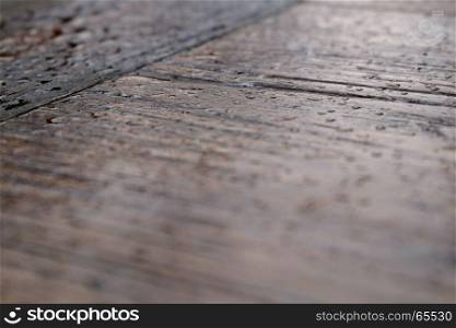 Raindrops on wood tabletop. Abstract background.