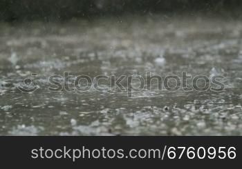 Raindrops splashes on the street