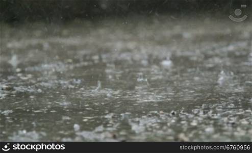 Raindrops splashes on the street