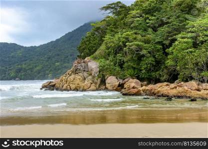 Rainforest encounter with all its exuberance with the sea in Trintade, Rio de Janeiro on a rainy day. Meeting of the rainforest with the sea