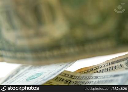 Raining dollar bills, closeup of money falling