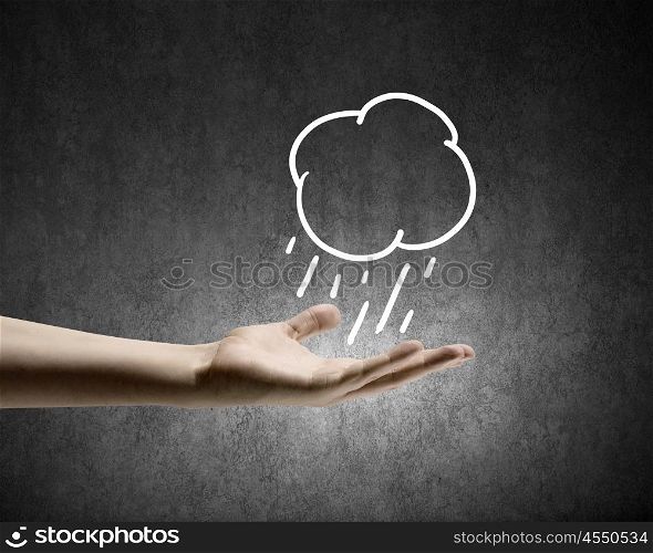 Raining weather. Background conceptual image with raining cloud in hand