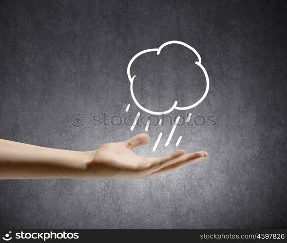 Raining weather. Background conceptual image with raining cloud in hand