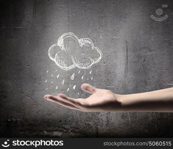 Raining weather. Background conceptual image with raining cloud in hand