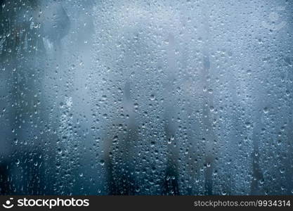 Rainy background, rain water drops on the window or in shower stall, autumn season backdrop, abstract textured wallpaper.. Rainy background, rain water drops on the window or in shower stall, autumn season backdrop, abstract textured wallpaper