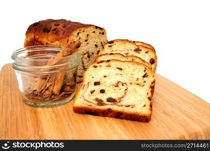 Raisin Bread And Cinnamon Sticks. Slices of raisin cinnamon bread with slices laid out showing the detail in the slice including the raisins