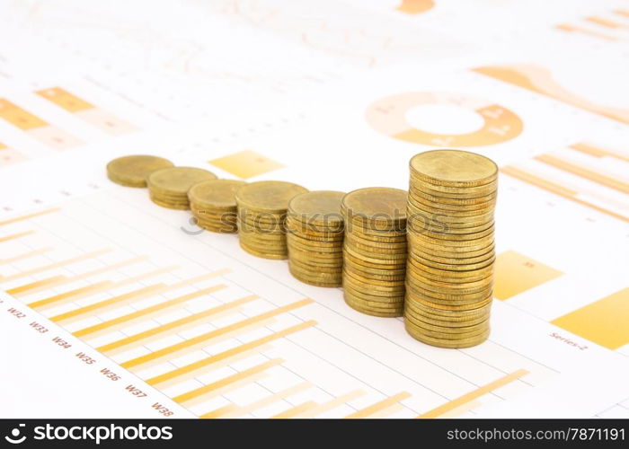 raising stacks of golden coins on yellow business graph, data and report background, concepts of inflation, investment, saving, trading and banking