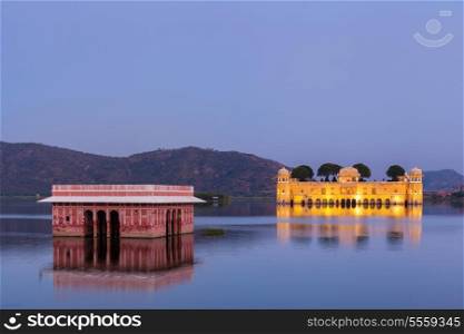 Rajasthan landmark - Jal Mahal (Water Palace) on Man Sagar Lake in the evening in twilight. Jaipur, Rajasthan, India