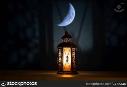 ramadan Kareem greeting photo with serene mosque background with beautiful glowing lantern.