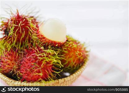 Rambutan peeled in a basket on table background / Fresh rambutan summer fruit from garden in Thailand