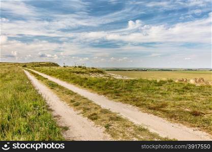 ranch road over prairie in eastern Kansas near Castle Rock, summer scenery,