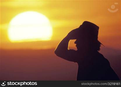 Ranch Worker at Sunset