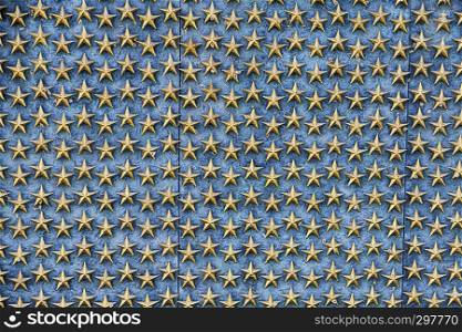 Ranks of bronze stars are arrayed on the Wall of Freedom at the World War II Memorial in Washington DC. Each star represents 100 Americans killed in the war.