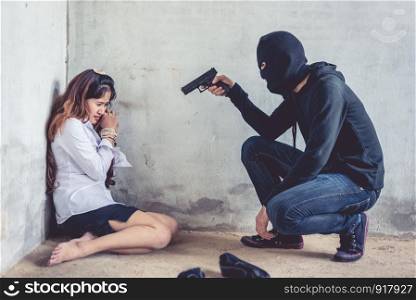 Ransom shooter aiming his gun at the hostage. Terrorist and Robber concept. Police and Soldier theme. Social issued theme.