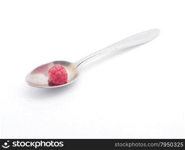 raspberries and spoon on a white background