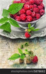 raspberries. Plucked raspberries in vintage iron ramekin.Photo tinted.Selective focus