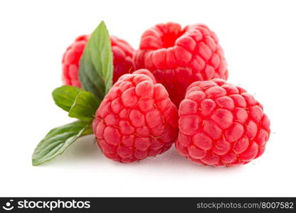 Raspberries with leaves isolated on white background