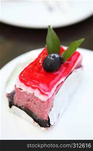 raspberry cake on wood background