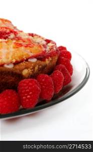 Raspberry Cake. Raspberry ring cake and fresh raspberries side view on a white background