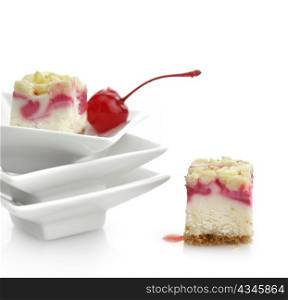 Raspberry Cheesecake Slices On White Background, Close Up
